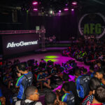 Mostrar a energia e diversidade da Copa AfroGames no Morro do Cantagalo, com jovens competidores em ação durante os torneios de eSports, além das expressões culturais que acompanham o evento, reforçando a inclusão digital e o protagonismo das comunidades periféricas no universo dos jogos eletrônicos.