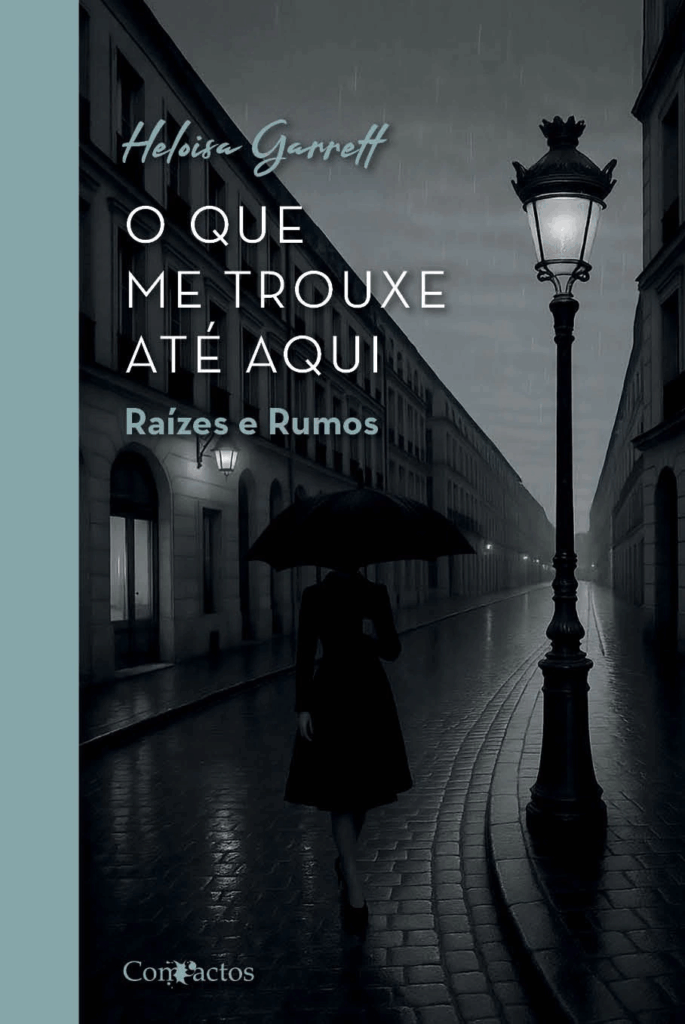 Capa do livro “O que me trouxe até aqui – Raízes e Rumos”, da escritora Heloisa Garrett, que reúne crônicas e contos ficcionais sobre vivências pessoais e ancestralidade.